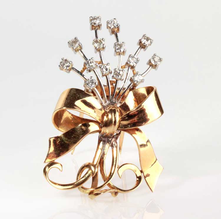 DIAMOND GOLD BROOCH; floral motif ... 