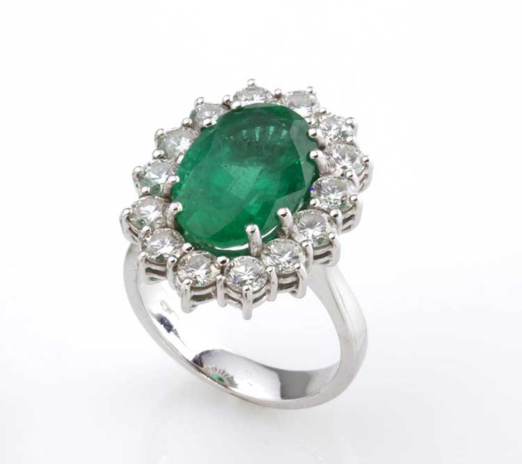 EMERALD AND DIAMOND RING; set with ... 