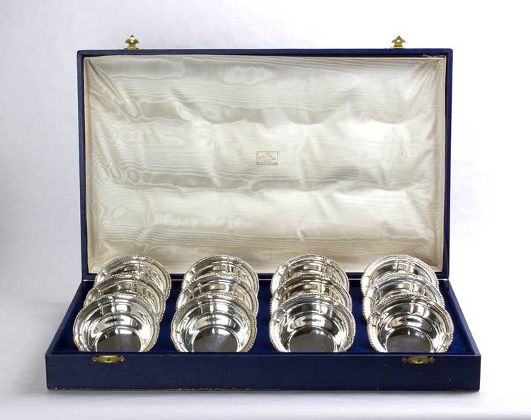 A SET OF  12 SOLID 800 ‰ SILVER  ... 