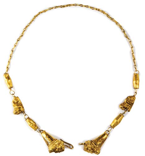 Gold necklace with lion’s heads ... 