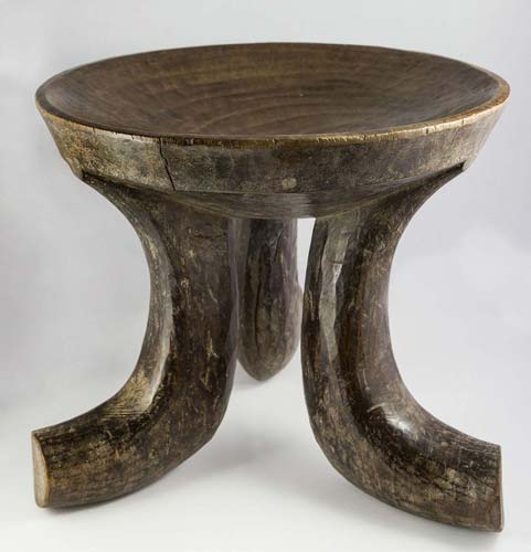 Ancient wooden stool with three ... 