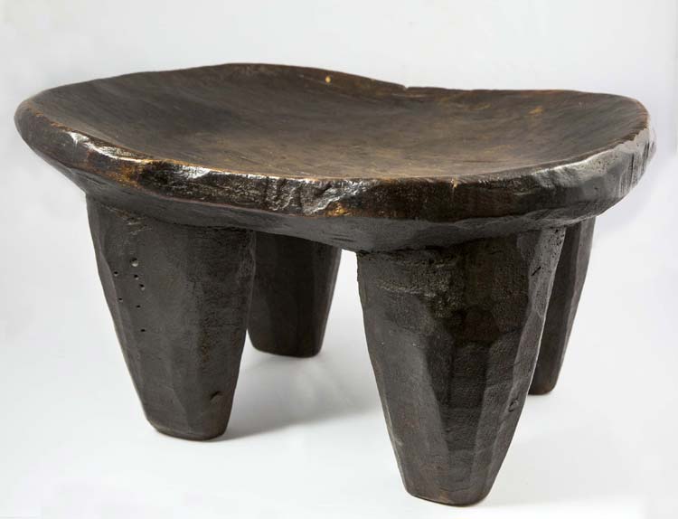 Ancient wooden stool with four ... 