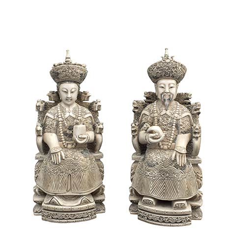 TWO IVORY CARVINGS OF THE SEATED ... 