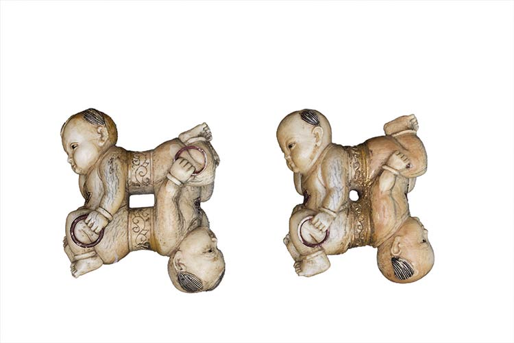 A PAIR OF PAINTED IVORY CARVINGS ... 