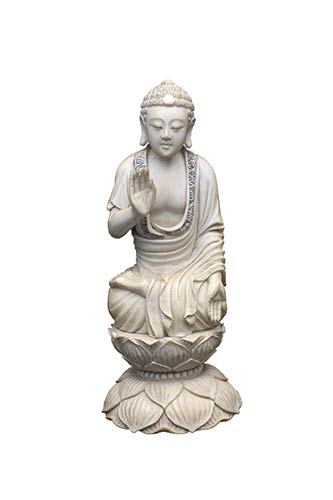 AN IVORY CARVING OF SEATED ... 