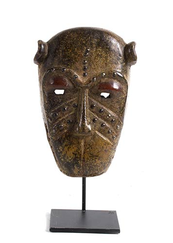 A BAULE WOODEN MASK FROM IVORY ... 