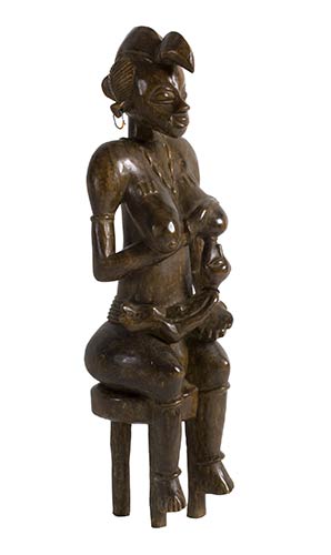 A SENUFO WOODEN MATERNITY FROM ... 
