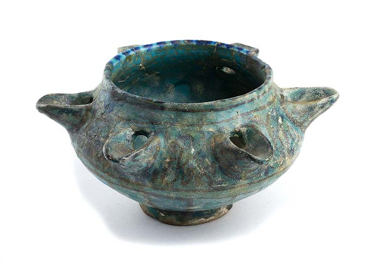 A TURQUOISE-GLAZED MOULDED ... 