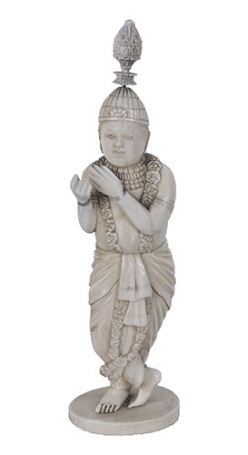 AN IVORY CARVING OF KRISHNA ... 