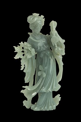 A JADEITE CARVING OF A STANDING ... 