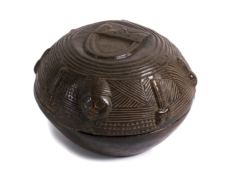 A WOODEN ROUND RITUAL BOWL WITH ... 