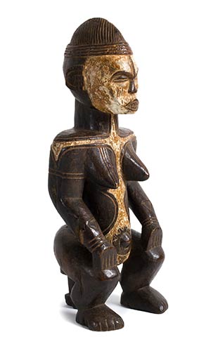 A WOODEN SEATED FEMALE FIGURE, ... 