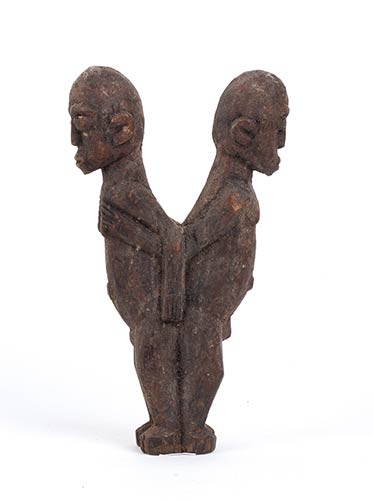 A WOOD SCULPTURE OF TWO MALE ... 