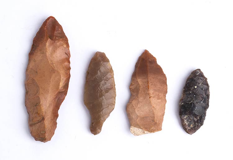 Group of four flint arrowheads ... 