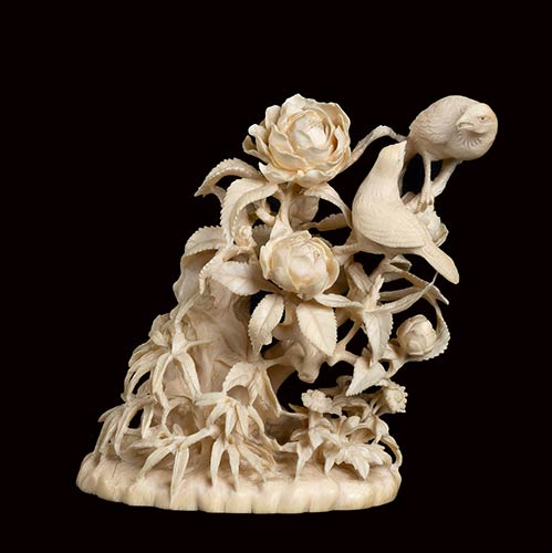 A CARVED IVORY FLORAL COMPOSITION ... 