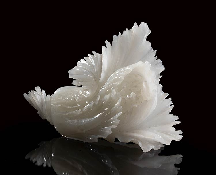 A WHITE JADE CARVING OF LEAVES ... 