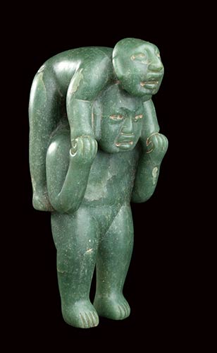 A GREEN JADE SCULPTURE OF TWO ... 