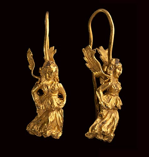 A greek gold hellenistic earring. ... 