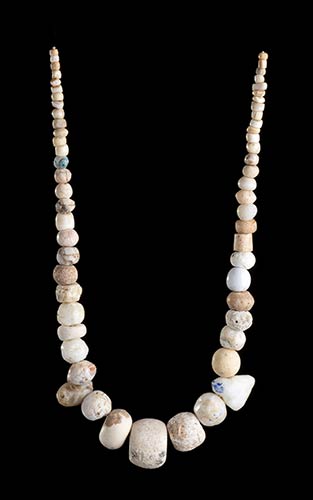 A STONE AND CONCHSHELL BEADS ... 