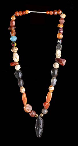 AN AGATE, CARNELIAN, OTHER STONES, ... 