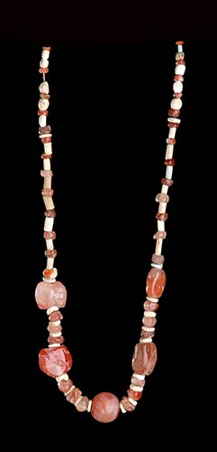 A CARNELIAN AND CONCHSHELL BEADS ... 