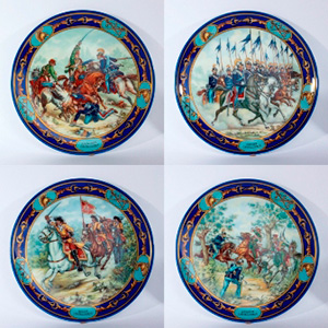Four porcelain painted plates depicting “ ... 