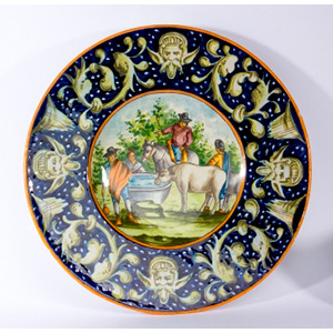 Painted ceramic plate with grotesque edge. ... 