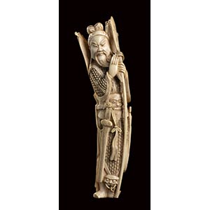 AN IVORY CARVING OF A STANDING GUANDIChina, ... 