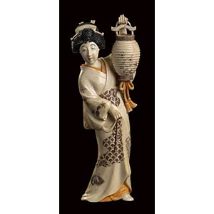 AN IVORY CARVING OF A STANDING GEISHAChina, ... 