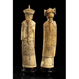 A PAIR OF IVORY CARVINGS WITH THE ... 