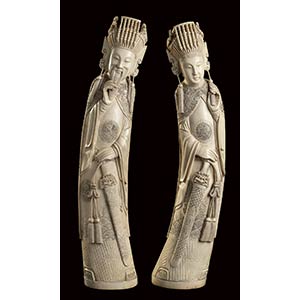 A PAIR OF LARGE IVORY CARVINGS OF STANDING ... 