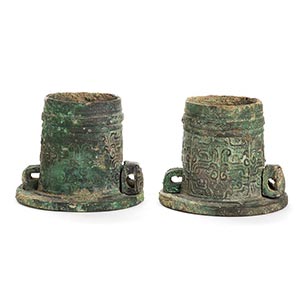 A PAIR OF BRONZE AXLE CAPS AND PINS, ... 
