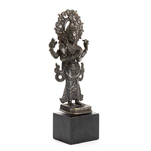 A SILVER ALLOY STANDING FOUR-ARMED ... 