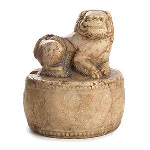 A MARBLE BUDDHIST LION ON A ROUND DRUMChina, ... 