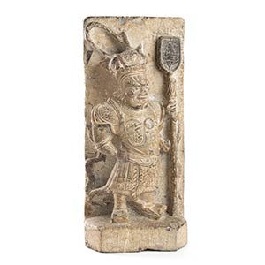 A STONE RELIEF WITH A STANDING FIGURE OF A ... 