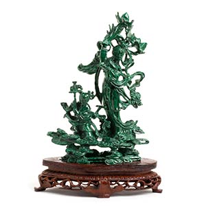 A MALACHITE CARVING OF A GROUP WITH FEMALE ... 