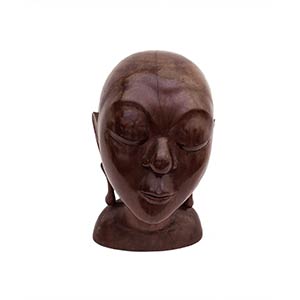 A BALINESE CARVED WOOD HEAD OF A GIRL
mid ... 