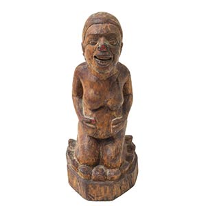 A BALINESE CARVED WOOD SCULPTURE OF A ... 