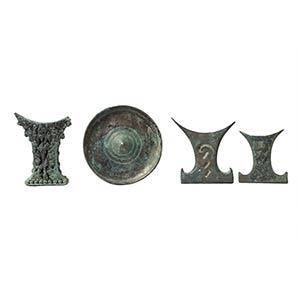 THREE INDONESIAN BRONZE MIRROR HANDLES AND A ... 