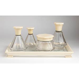 A French silver, ivory and glass vanity set ... 