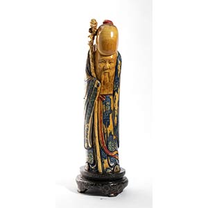 A Chinese  ivory carving depicting Shoulau - ... 