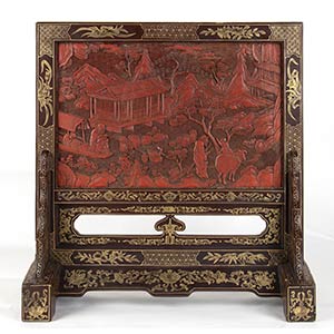A LACQUERED, GILT AND CARVED WOOD TABLE ... 
