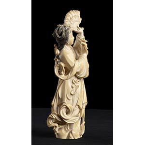 AN IVORY SCULPTURE OF A FEMALE ... 
