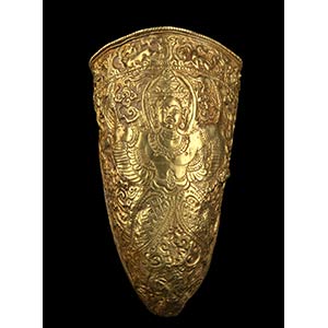 A GOLD HORN-SHAPED CONTAINER WITH A ... 