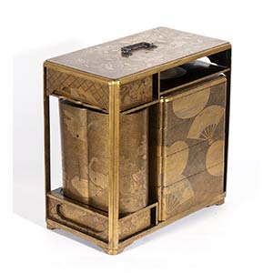 A LACQUERED AND GILT WOOD PORTABLE PICNIC ... 