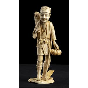 AN IVORY OKIMONO WITH A STANDING ... 