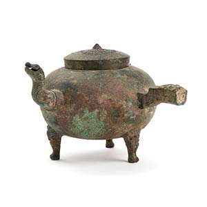 A BRONZE HANDLED AND SPOUTED GLOBULAR EWER, ... 