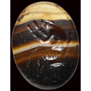 A roman banded agate intaglio. Seated ... 