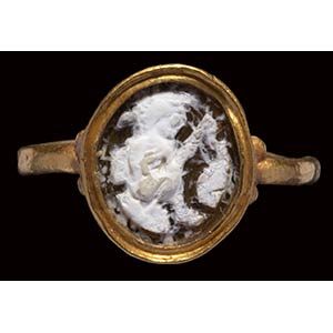 A roman burnt agate cameo mounted in a gold ... 
