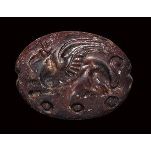 A mycenaean red jasper engraved seal. ... 